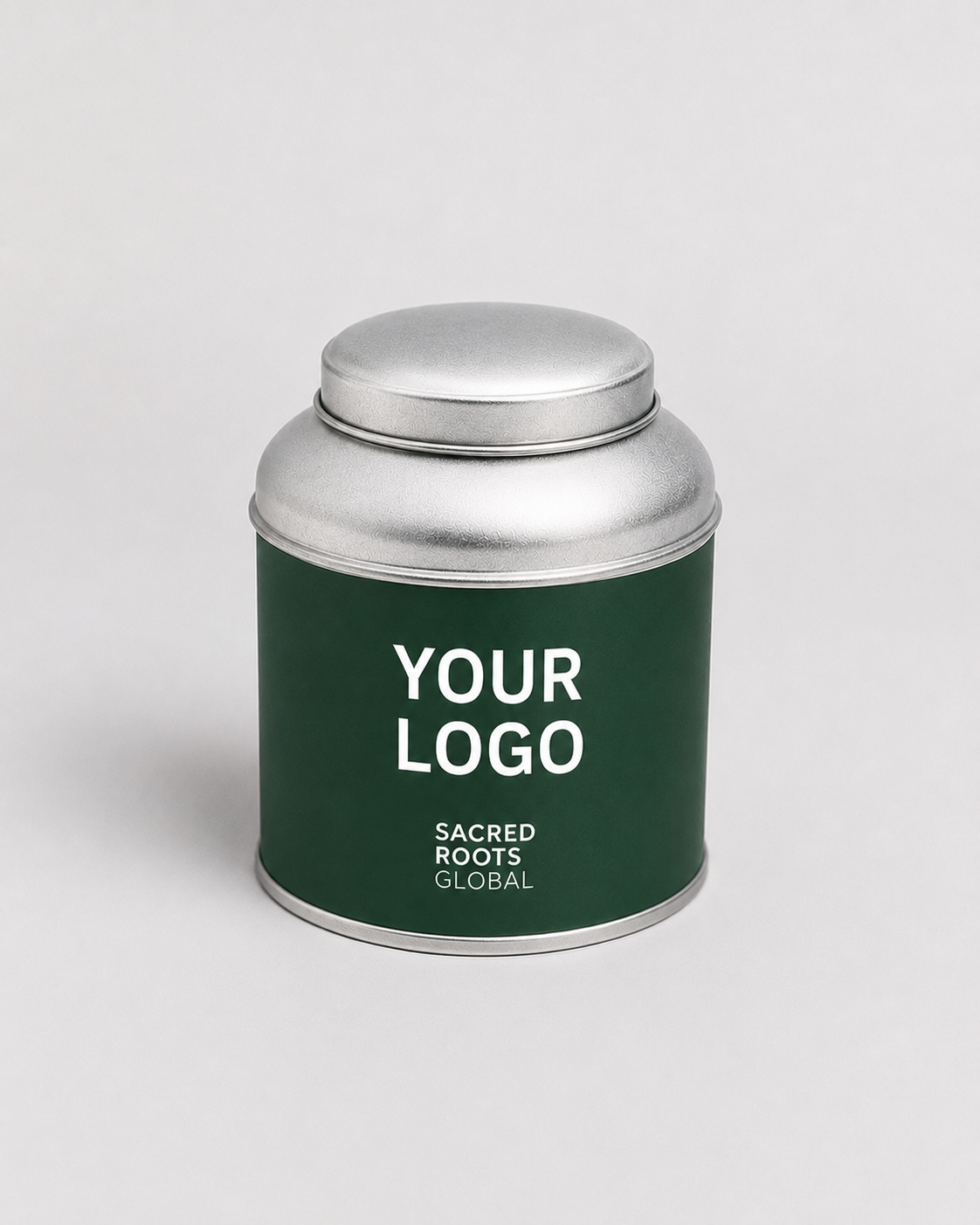 A premium silver cylindrical metal tea canister, ready for your own branding. Simply add your logo and packaging design to create a bespoke tea tin for your brand.